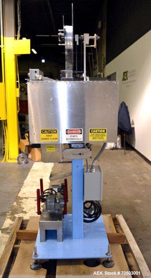 Used PDC Model 65M Tamper Evident Neck Banding Machine. Capable of speeds up to 200 bottles per minute. Band Diameter:3/8" to 3". Band Height 3/4" - 2". Set up for clear or continuous print film (no ...