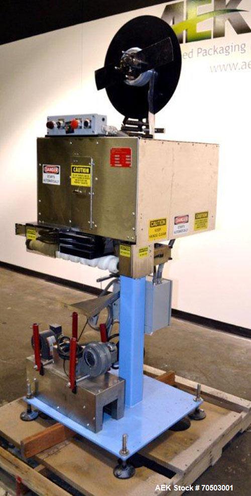 Used PDC Model 65M Tamper Evident Neck Banding Machine. Capable of speeds up to 200 bottles per minute. Band Diameter:3/8" to 3". Band Height 3/4" - 2". Set up for clear or continuous print film (no ...