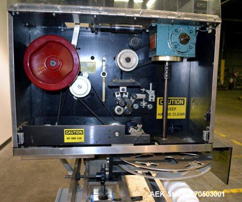 Used PDC Model 65M Tamper Evident Neck Banding Machine. Capable of speeds up to 200 bottles per minute. Band Diameter:3/8" to 3". Band Height 3/4" - 2". Set up for clear or continuous print film (no ...