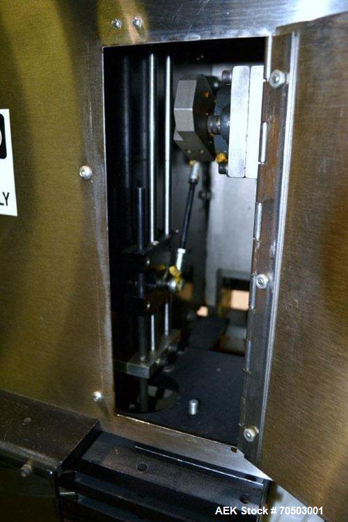 Used PDC Model 65M Tamper Evident Neck Banding Machine. Capable of speeds up to 200 bottles per minute. Band Diameter:3/8" to 3". Band Height 3/4" - 2". Set up for clear or continuous print film (no ...