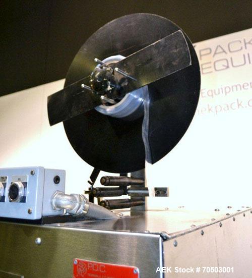 Used PDC Model 65M Tamper Evident Neck Banding Machine. Capable of speeds up to 200 bottles per minute. Band Diameter:3/8" to 3". Band Height 3/4" - 2". Set up for clear or continuous print film (no ...