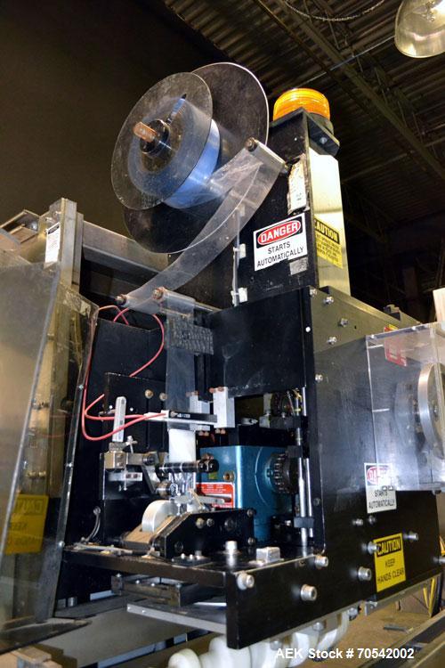 Used PDC Model 75-M Tamper Evident Neck Bander. Capable of speeds up to 300 bottles per minute. Band size range: (Diameter) 3/8" to 3", (Height) 3/4" to 2". Band cut off: Unregistered. Has wormscrew ...