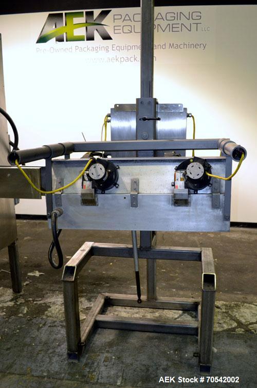 Used PDC Model 75-M Tamper Evident Neck Bander. Capable of speeds up to 300 bottles per minute. Band size range: (Diameter) 3/8" to 3", (Height) 3/4" to 2". Band cut off: Unregistered. Has wormscrew ...