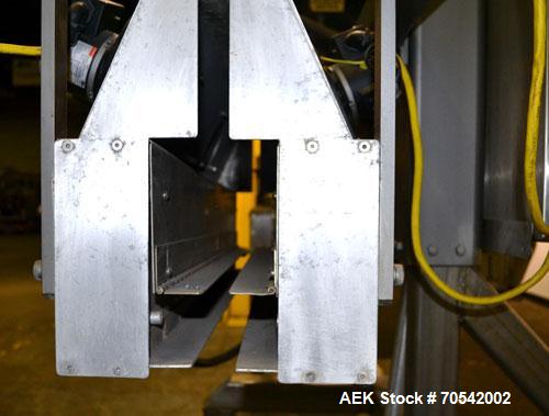 Used PDC Model 75-M Tamper Evident Neck Bander. Capable of speeds up to 300 bottles per minute. Band size range: (Diameter) 3/8" to 3", (Height) 3/4" to 2". Band cut off: Unregistered. Has wormscrew ...