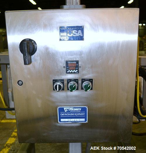 Used PDC Model 75-M Tamper Evident Neck Bander. Capable of speeds up to 300 bottles per minute. Band size range: (Diameter) 3/8" to 3", (Height) 3/4" to 2". Band cut off: Unregistered. Has wormscrew ...