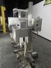 Used Axon Model EZ-100 Heat Shrink Tamper Evident Band & Sleeve Label Applicator. Rated up to 150 ppm depending on the container. Machine is of stainless steel construction. Sleeve size 20 to 100mm f...
