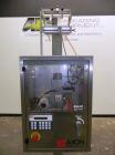 Used Axon Model EZ-100 Heat Shrink Tamper Evident Band & Sleeve Label Applicator. Rated up to 150 ppm depending on the container. Machine is of stainless steel construction. Sleeve size 20 to 100mm f...