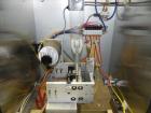 Used Axon Model EZ-100 Heat Shrink Tamper Evident Band & Sleeve Label Applicator. Rated up to 150 ppm depending on the container. Machine is of stainless steel construction. Sleeve size 20 to 100mm f...