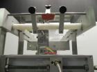 Used Axon Model EZ-100 Heat Shrink Tamper Evident Band & Sleeve Label Applicator. Rated up to 150 ppm depending on the container. Machine is of stainless steel construction. Sleeve size 20 to 100mm f...