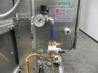 Used Axon Model EZ-100 Heat Shrink Tamper Evident Band & Sleeve Label Applicator. Rated up to 150 ppm depending on the container. Machine is of stainless steel construction. Sleeve size 20 to 100mm f...