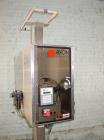Used Axon Heat Shrink Tamper Evident Band & Sleeve Label Applicator, Model EZ100, Stainless Steel. Rated up to 150 ppm depending on the container. Sleeve size 20 to 100mm flat x 25 to 200mm high x 40...