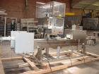 Used Axon EZ300 Stainless Steel Neck Bander With Stainless Steel Tunnel. Capable of speeds up to 70 containers per minute. Can handle product container widths from 2-3/8