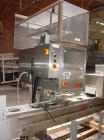 Used Axon EZ300 Stainless Steel Neck Bander With Stainless Steel Tunnel. Capable of speeds up to 70 containers per minute. Can handle product container widths from 2-3/8