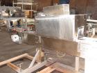 Used Axon EZ300 Stainless Steel Neck Bander With Stainless Steel Tunnel. Capable of speeds up to 70 containers per minute. Can handle product container widths from 2-3/8