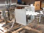 Used Axon EZ300 Stainless Steel Neck Bander With Stainless Steel Tunnel. Capable of speeds up to 70 containers per minute. Can handle product container widths from 2-3/8