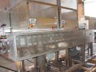 Used Axon EZ-2-400 Twin Head Stainless Steel Neck Bander With Twin Stainless Steel Heat Tunnels. Capable of speeds up to 90 CPM. Container size range widths from 3-11/16