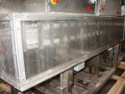Used Axon EZ-2-400 Twin Head Stainless Steel Neck Bander With Twin Stainless Steel Heat Tunnels. Capable of speeds up to 90 CPM. Container size range widths from 3-11/16