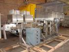 Used Axon EZ-2-400 Twin Head Stainless Steel Neck Bander With Twin Stainless Steel Heat Tunnels. Capable of speeds up to 90 CPM. Container size range widths from 3-11/16