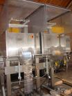 Used Axon EZ-2-400 Twin Head Stainless Steel Neck Bander With Twin Stainless Steel Heat Tunnels. Capable of speeds up to 90 CPM. Container size range widths from 3-11/16