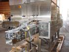 Used Axon EZ-2-400 Twin Head Stainless Steel Neck Bander With Twin Stainless Steel Heat Tunnels. Capable of speeds up to 90 CPM. Container size range widths from 3-11/16
