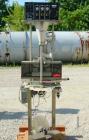 Used Kalsih Bandit Neck Bander, model 5400. Manually adjustable size range, and height. Driven by a 1/6hp, 1/60/120 volt motor. Mounted on a stainless steel frame. Built 1993