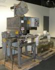Used PDC 50 Tamper Evident Neck Bander and Shrink Sleeve Labeling Machine, capable of speeds from 50 to 130 CPM. Band/Sleeve size range: Diameter .375