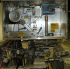 Used PDC 50 Tamper Evident Neck Bander and Shrink Sleeve Labeling Machine, capable of speeds from 50 to 130 CPM. Band/Sleeve size range: Diameter .375