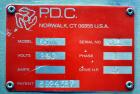 Used PDC Model 65M Tamper Evident Neck Banding Machine. Capable of speeds up to 200 bottles per minute. Band Diameter:3/8