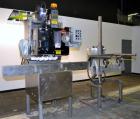 Used PDC Model 75-M Tamper Evident Neck Bander. Capable of speeds up to 300 bottles per minute. Band size range: (Diameter) 3/8