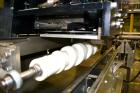 Used PDC Model 75-M Tamper Evident Neck Bander. Capable of speeds up to 300 bottles per minute. Band size range: (Diameter) 3/8