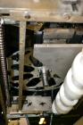 Used PDC Model 75-M Tamper Evident Neck Bander. Capable of speeds up to 300 bottles per minute. Band size range: (Diameter) 3/8