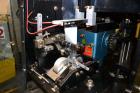 Used PDC Model 75-M Tamper Evident Neck Bander. Capable of speeds up to 300 bottles per minute. Band size range: (Diameter) 3/8