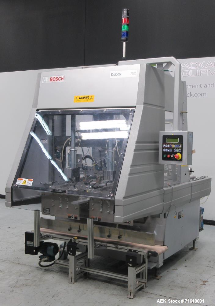 Used Bosch (Doboy) Model 7520 Automatic Dual Head Tray Former and Top Load Carton Former. Capable of speeds from 50 - 150 Trays/Cartons per minute (depending on application). Set up with Nordson Pro ...