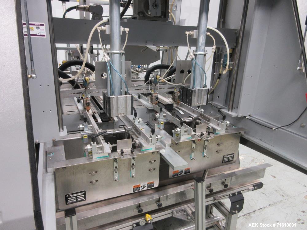 Used Bosch (Doboy) Model 7520 Automatic Dual Head Tray Former and Top Load Carton Former. Capable of speeds from 50 - 150 Trays/Cartons per minute (depending on application). Set up with Nordson Pro ...