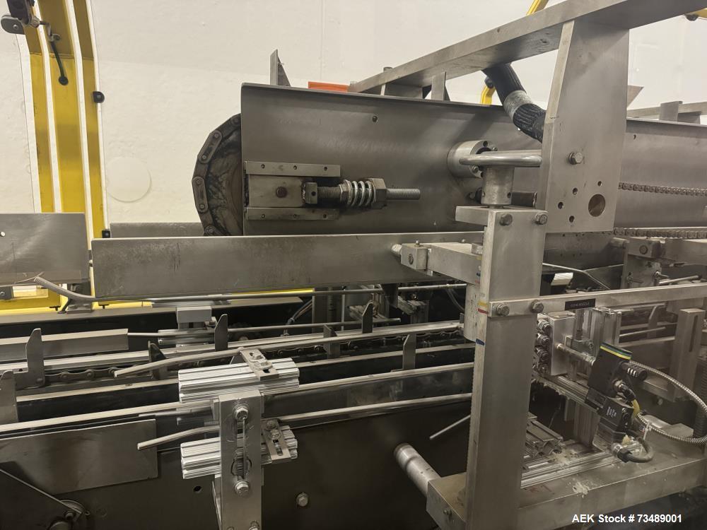 Used Adco Model 12LBC100-EC Automatic Horizontal Cartoner with Top Squaring for Large Width Cartons. Machine is capable of speeds up to 25 to 100 cartons per minute depending on carton size and appli...