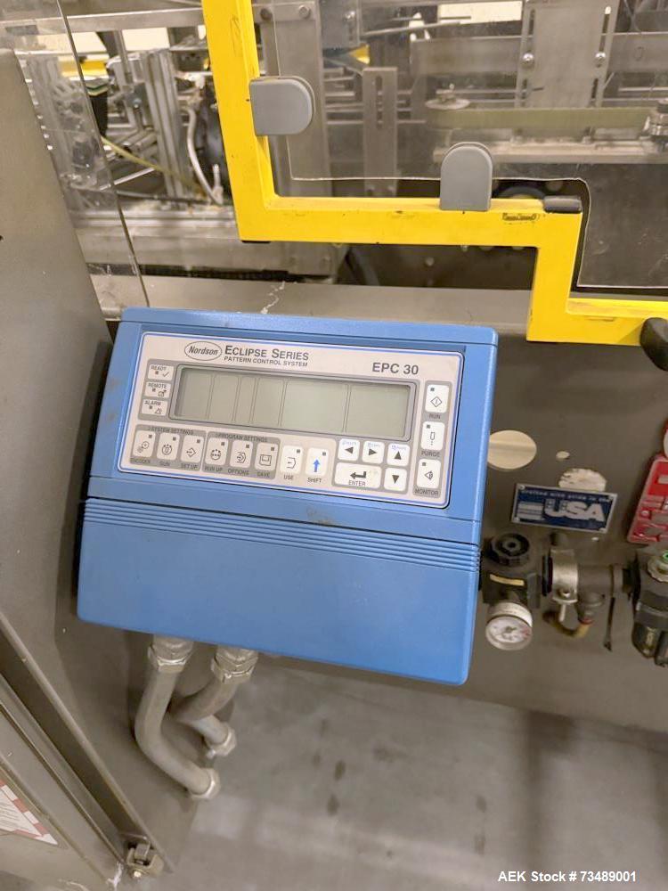 Used Adco Model 12LBC100-EC Automatic Horizontal Cartoner with Top Squaring for Large Width Cartons. Machine is capable of speeds up to 25 to 100 cartons per minute depending on carton size and appli...