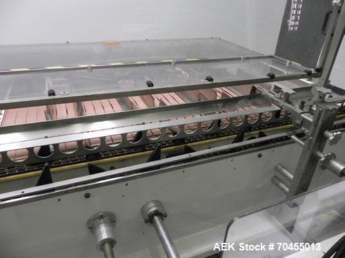 Used Adco Model 15DBC105-EC Automatic Horizontal Cartoner. Capable of speeds from 50 to 125 cartons per minute. Has two head rotary carton feed with 4' long magazine. Machine is set on 12" centers fo...