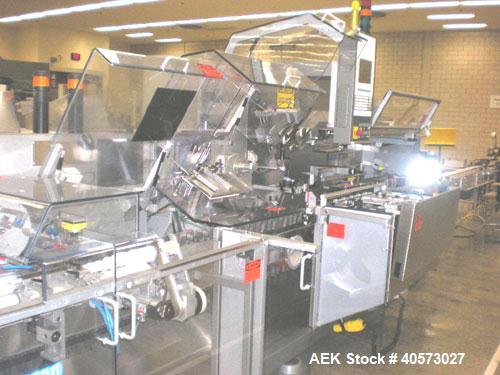 Used: Uhlmann C2205 automatic horizontal cartoner capable of speeds up to 300 CPM. Has worm screw bottle feeder, prefolded and sheet fed leaflet feeders, emboss date coders. Unit is on 5" centers for...