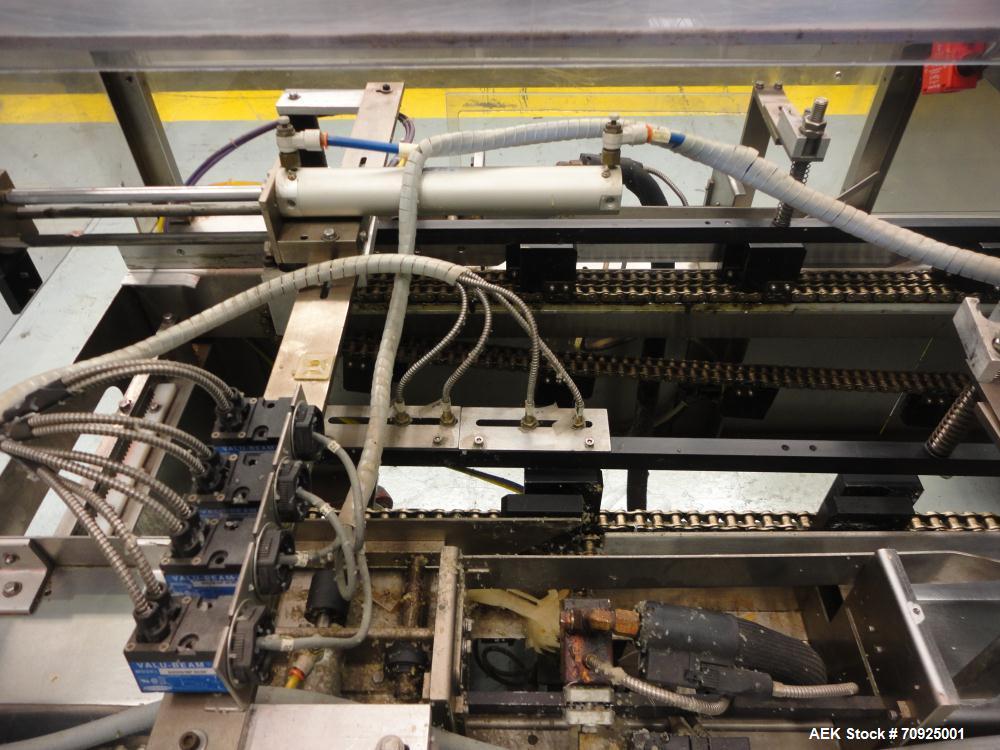 Used Econocorp Spartan Automatic Horizontal Glue Cartoner capable of speeds up to 40 cartons per minute. Has 12" centers for carton size range:  length 4" - 10" , width 1" - 4",  depth 8" (approx)  -...