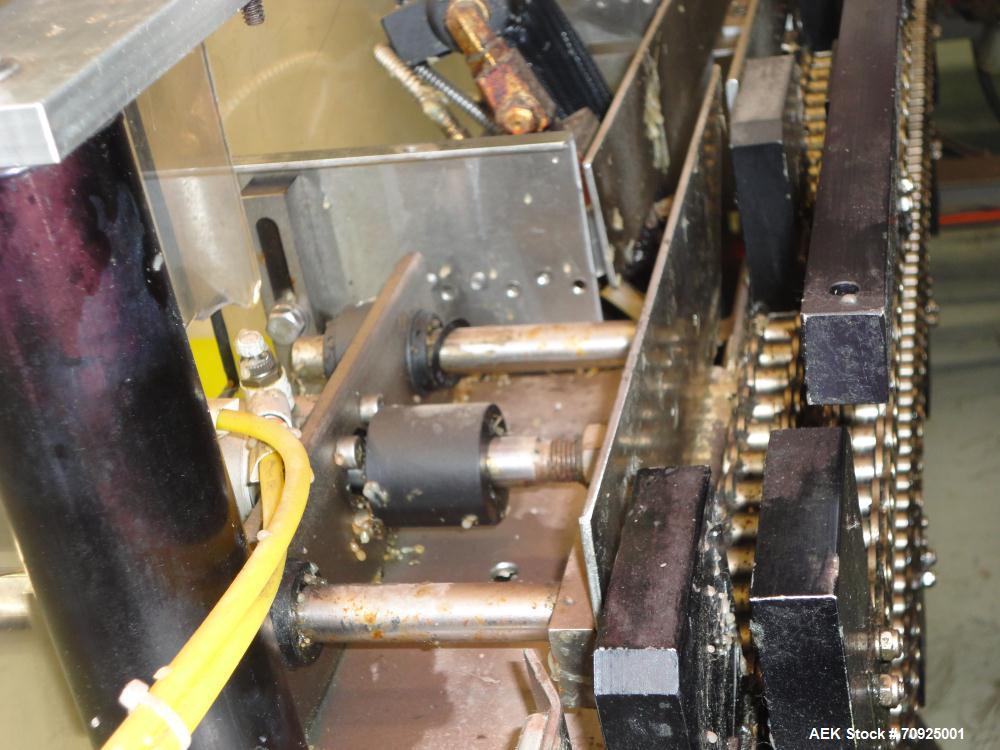 Used Econocorp Spartan Automatic Horizontal Glue Cartoner capable of speeds up to 40 cartons per minute. Has 12" centers for carton size range:  length 4" - 10" , width 1" - 4",  depth 8" (approx)  -...