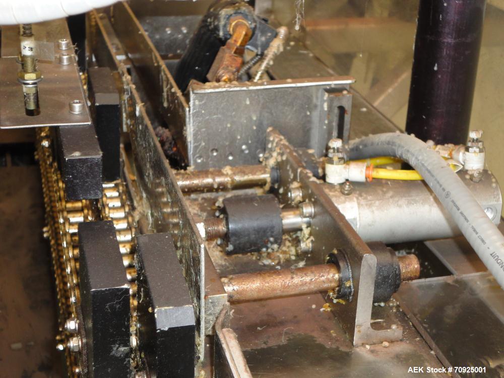 Used Econocorp Spartan Automatic Horizontal Glue Cartoner capable of speeds up to 40 cartons per minute. Has 12" centers for carton size range:  length 4" - 10" , width 1" - 4",  depth 8" (approx)  -...