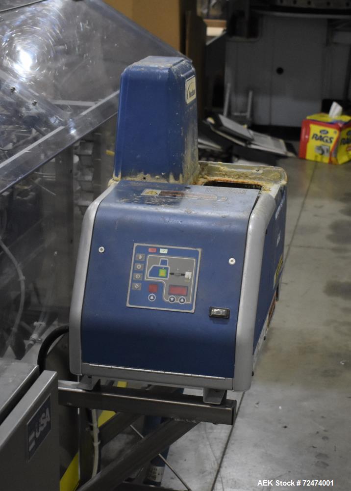 Used- Econocorp Econoseal Spartan Automatic Horizontal Intermittent Hotmelt Glue Cartoner. Capable of speeds up to 40 carton...