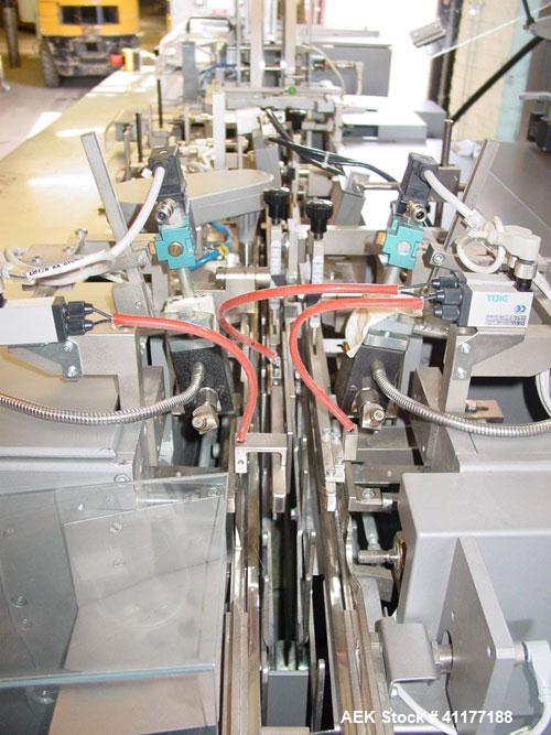 Used Marchesini Horizontal Cartoner, model BA100. Machine is capable of speeds up to 120 cpm. Horizontal intermittant motion cartoner set up for glue style cartons with embosse date coder and automat...
