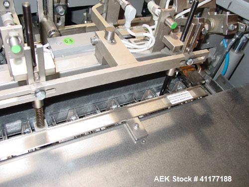 Used Marchesini Horizontal Cartoner, model BA100. Machine is capable of speeds up to 120 cpm. Horizontal intermittant motion cartoner set up for glue style cartons with embosse date coder and automat...