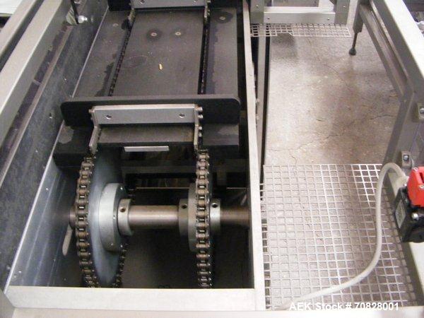 Used Rama RM A2C Horizontal Cartoner.  Maximum box size 11.8" x 11.8" x 2.7" (300 x 300 x 70 mm).  Minimum box size 4.7" x 3.9" x 0.7" (120 x 100 x 20 mm).  With rotary carton feeder.  (1) Control pa...