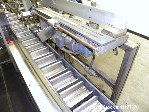 Used Tisma Automatic Horizontal Glue Cartoner, Model 600-SE. Capable of speeds over 200 CPM. Has 5" centers for a carton size range: length 1" to 4-1/4", depth 3" to 7", width 1/2" to 3". Has four he...