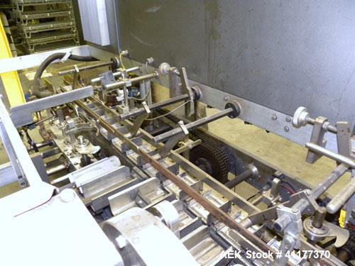 Used Tisma Automatic Horizontal Glue Cartoner, Model 600-SE. Capable of speeds over 200 CPM. Has 5" centers for a carton size range: length 1" to 4-1/4", depth 3" to 7", width 1/2" to 3". Has four he...