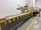 Used Adco Model 12LBC100-EC Automatic Horizontal Cartoner with Top Squaring for Large Width Cartons. Machine is capable of speeds up to 25 to 100 cartons per minute depending on carton size and appli...