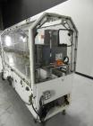 Used Adco Model 15DBC105-EC Automatic Horizontal Cartoner. Capable of speeds from 50 to 125 cartons per minute. Has two head rotary carton feed with 4' long magazine. Machine is set on 12