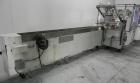 Used Adco Model 15DBC105-EC Automatic Horizontal Cartoner. Capable of speeds from 50 to 125 cartons per minute. Has two head rotary carton feed with 4' long magazine. Machine is set on 12